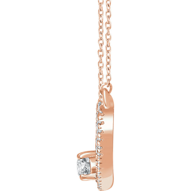 Chic and sparkling, this diamond two stone necklace features round diamonds in 14k rose gold, and a matching cable chain. This necklace can be worn at 16 or 18 inches in length.