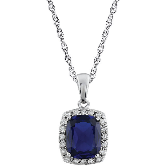 This stunning 14K white gold solitaire pendant necklace features a 10x8mm cushion Created Blue Sapphire that is complemented by brilliant-cut round diamonds. This september birthstone jewelry would look perfect with any outfit.