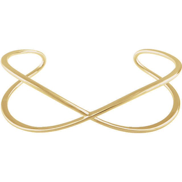 This criss cross cuff bangle bracelet is made of polished 14kt yellow gold.