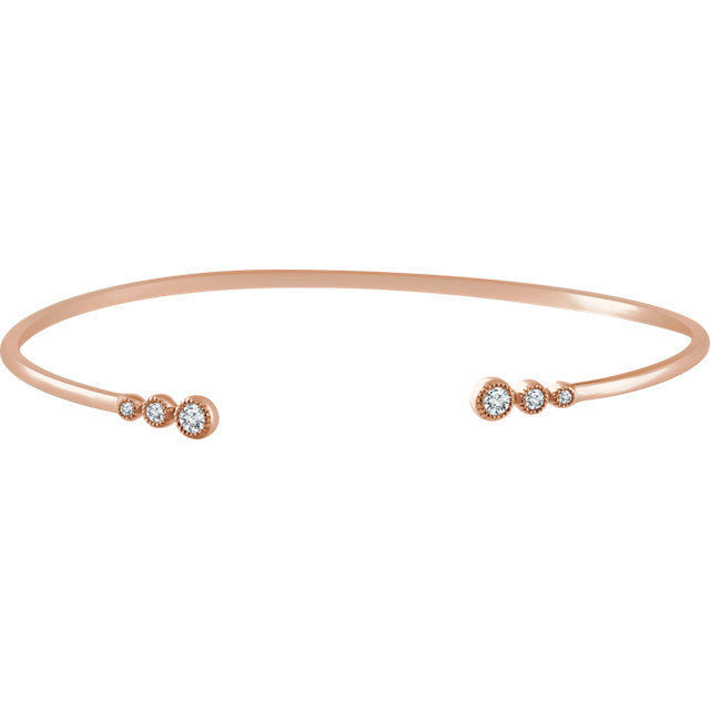 This graduated bangle bracelet showcases round diamonds set in 14k rose gold.