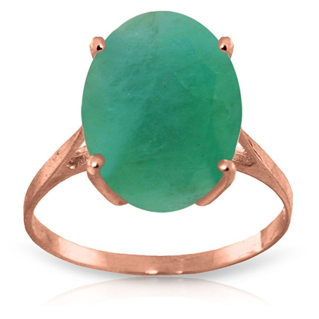 A 14K Gold ring featuring an oval-shaped Natural Emerald, creating a majestic aura. This ring is almost as elegant as the lady who will wear it, and she is sure to love it.