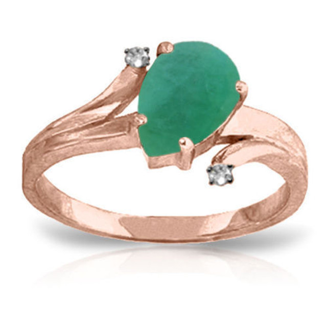 A pear shaped Emerald is embraced in this 14 karat Ring while being protected by two Genuine Diamonds. Since this stone is the birthstone of May, it makes a great gift for a May born girl.