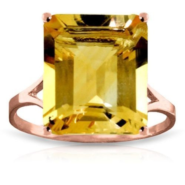  Look absolutely dazzling when you place this 14k gold ring with octagon citrine upon your finger. Citrine is known for its radiant beauty, which is made even more breathtaking when cut in a unique octagon shape. The stone weighs 6.50 carats, adding a jaw dropping amount of sparkle that makes this piece so popular. The gold band has a simple design, with openings on either side of the stone to emphasize the beauty and color. This ring makes an amazing birthstone ring, or is perfect for anyone who loves pieces that are big, bold, and beautiful.