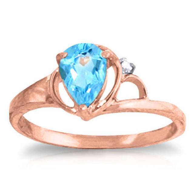 This elegant 14k gold ring will make you feel like a princess. A stunning blue topaz is cradled in tear-drop prong setting. The ring is 8.4mm in width and 22.6mm in height. A small diamond accents the upper portion of the ring to give sparkle and shine, but it is subtle and not overly flashy. The bright blue color works well with the gold ring, and is perfect for regular wear or special occasions. The blue topaz makes it a great birthstone gift as well.