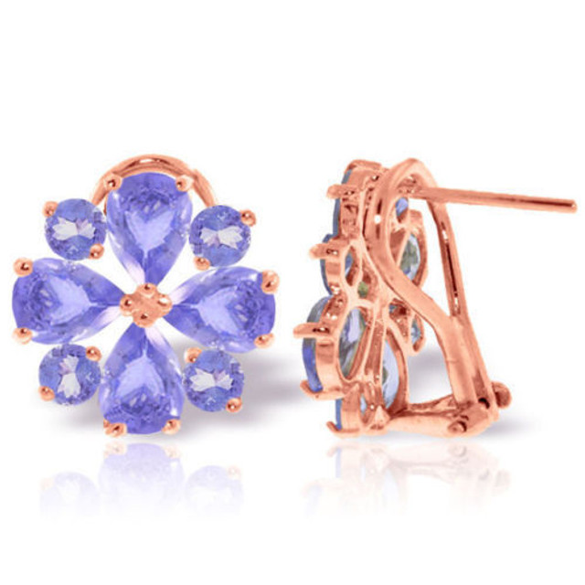 You will be blown away by the stunning periwinkle color of these 14K gold French Clip Earrings with Natural Tanzanites. These gentle gemstone beauties offer amazing vibrance and unparalleled shine. Each earring features four 3.25 carat Tanzanite stones that are pear shaped. These stones are set in a flower design and each petal is separated by another 1.60 carat round Tanzanite jewel. They are detailed, dressy, and will make you feel fresh and beautiful. Since they are made of 14K gold, these will last a lifetime. Bring color and class to your outfit with these amazing, mood-lifting french clips.