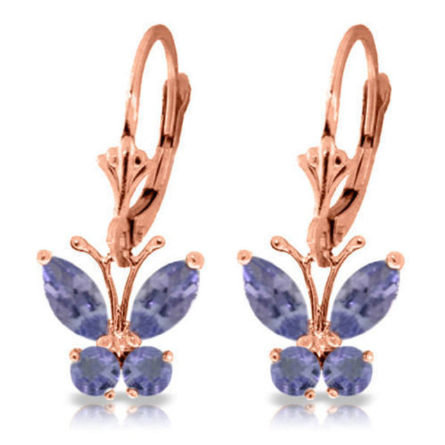 Periwinkle butterflies. What more could a girl ask for? You will feel free and easy when you wear these 14K gold Butterfly Earrings with Natural Tanzanites. Each earring is made with two marquise shaped 0.85 carat and two round shaped 0.39 carat Tanzanite jewels. These amazing stones are arranged and set into a butterfly design.


These earrings dangle 23.6mm, just right for getting noticed but still having the delicate and feminine appeal that all butterflies demand. The earring bases are leverback style and are made of 14K gold. What more could a girl want than these fluttery beauties that seem right out of a cottage garden?