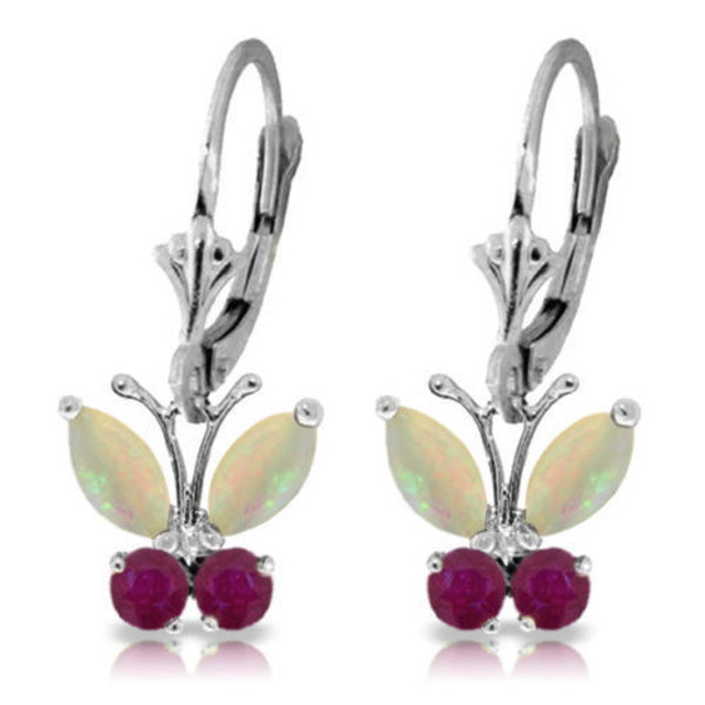 These 14k gold butterfly earrings with opals and rubies will make any woman walk on air when she wears them. The gorgeous fluttering butterfly design is unique and cute, with a touch of feminine appeal that makes them absolutely radiant. Four marquise cut opals weighing one full carat form the wings of two identical butterflies, while four round cut rubies form the rest of the shape. The contrasting colors look amazing paired together. The leverback design allows these butterflies to always fly and move whenever they are worn. Rubies are natural gems which have inclusions which make each stone unique, something not found in lab enhanced gems.