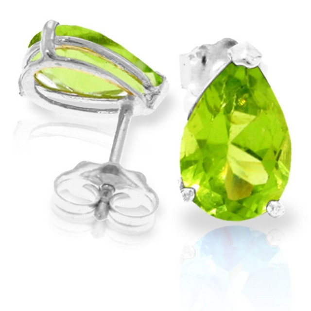 A woman can never have too many stud earrings. In fact, no jewelry box is complete without a pair of beautifully brightly colored studs that go with everything. These 14k gold stud earrings with natural peridot are a perfect choice as birthstone earrings or as a pair of studs that can highlight any outfit. With a total of three carats of pear shaped natural peridot, these earrings offer plenty of shine from within their gorgeous color, adding a bright hue to anything that they are paired with.