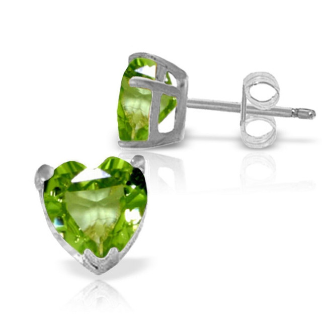 Classic gemstone studs are a piece that are perfect for everyday wear to look colorful and bright. With these 14k gold stud earrings with peridot, gold, gemstones, and a gorgeous heart shape are used to form studs that are stylish enough to wear anytime. Two heart shaped stones add feminine charm and appeal, while over three carats of dazzling sparkle show off the stunning color of natural peridot. These earrings would make a standout gift for those celebrating birthdays in August or also make a great pair of earrings that are suitable to wear for any occasion.