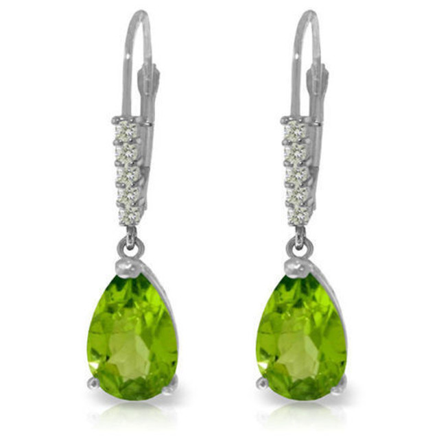 These 14k gold leverback earrings with natural diamonds and peridot are the perfect choice for women who love to wear fun dangling earrings. The leverback style is used to create movement and show off the beautiful diamonds and peridot stones that each pair creates, while being comfortable and sleekly crafted from 14k yellow, white, or rose gold. Ten total diamonds adorn the surface of each pair, with five genuine stones studding each earring. A dangling pear cut solitaire peridot hangs from each setting, each stone weighing 1.50 carats to show off the bright, glowing beauty of August's beautiful birthstone.