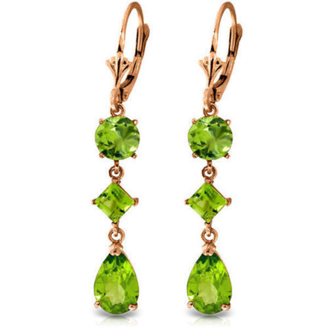 Various shapes of Natural Peridots form this gorgeous pair of Drop Earrings set in 14 karat Gold. Enjoy this precious gemstone earrings for life.