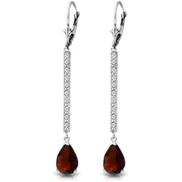 Be radiant in these 14K gold Earrings with Diamonds & Garnets. Shining like the stars in the sky, these earrings twinkle with every bit of movement. Ten diamonds dot each earring for a total of twenty sparkling diamonds on your ears. The two garnets are deep red and begging to be paired with a glamorous dress. The two pear-shaped garnets are a total of 3.50 carats, and the diamonds are a total of 0.10 carats. Each stone is carefully selected to provide the most affordable earring with the prettiest stones. These earrings are certainly special, and make a wonderful gift. Choose from yellow, white or rose gold.