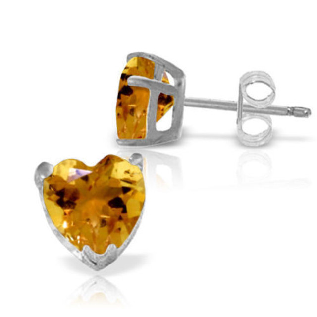  Citrine studs make a wonderful birthday gift for all beautiful women born in the month of November. These 14k gold stud earrings with natural citrine show off the warmth and beauty of this gorgeous stone in a style that is easy to wear. Each pair features two heart shaped citrine stones that are simply radiant and charming, with both gemstones weighing over three carats for classic glitz and glamor. Each earrings features gold prongs, posts, and friction push backs that hold them securely in place while making them comfortable enough to wear daily.