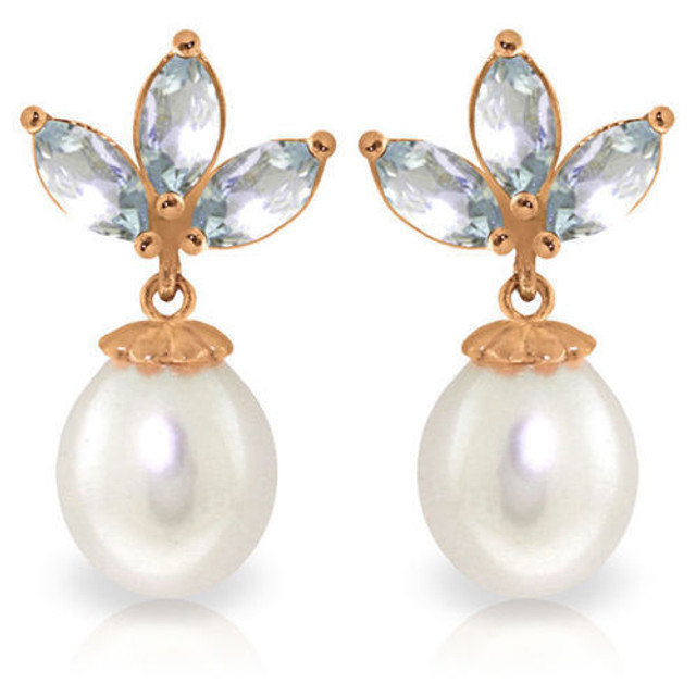 Dainty elegance is what you will get with these 14K rose gold Dangling Earrings with Pearls & Aquamarines. Wear your beautiful hair up in a bun to fully show off these classic beauties. Each earring features a single 8 carat pear shaped white Pearl and three marquis shaped 1.50 carat semiprecious Aquamarine gemstones.


These earrings are secured by post-friction pushbacks. The setting is crafted of 14K rose gold for a lifetime of enjoyment. Wear these to dinner, to the theater, or to a special party. If tasteful elegance is what you seek, then look no further; it is to be found right here.