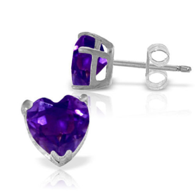 Dainty heart jewelry is the perfect way to show that special someone how much they are adored. With these 14k white gold stud earrings with natural amethysts, beautiful color, sparkling gemstones, and a feminine shape is combined to create a stunning pair of earrings. Two heart shaped purple amethysts gems glimmer brightly from the earlobes, boasting over three carats of pure beauty. The 14k yellow gold prongs and posts, secured with friction push backs, makes these earrings look classic while they are held securely in place in each earlobe. These earrings make a great gift for those who celebrate a birthday in February.
