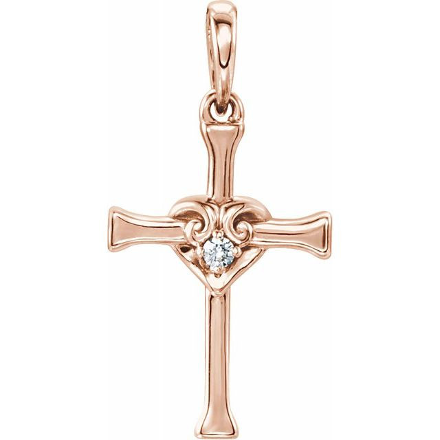 A classic diamond cross pendant. A single small diamond set in a heart at the center. The diamond is genuine and natural, fully cut, weighing .025 carats.