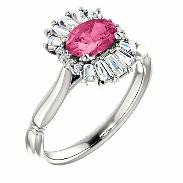 Crafted in 14k white gold, this ring features one oval Genuine Pink Tourmaline gemstone accented with 18 genuine diamonds. 