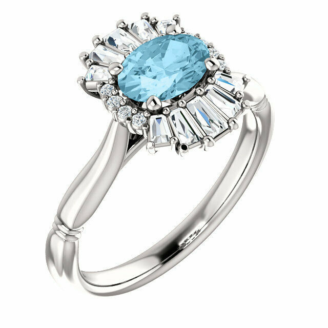 Crafted in sterling silver, this ring features one oval Genuine Aquamarine gemstone accented with 18 genuine diamonds. 