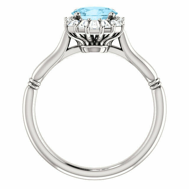 Crafted in sterling silver, this ring features one oval Genuine Aquamarine gemstone accented with 18 genuine diamonds. 