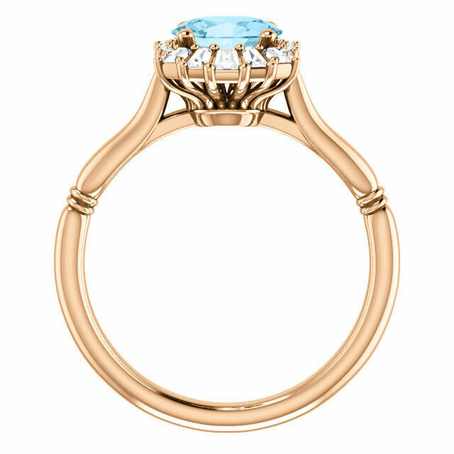 Crafted in 14k rose gold, this ring features one oval Genuine Aquamarine gemstone accented with 18 genuine diamonds. 