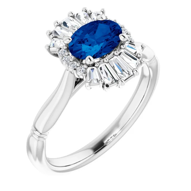 Crafted in 14k white gold, this ring features one oval Genuine Blue Sapphire gemstone accented with 18 genuine diamonds. 