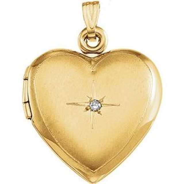 Win her heart with this dazzling diamond heart locket in 14k yellow gold.