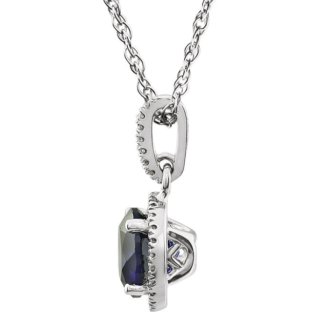 Created Blue Sapphire and Diamond 14k White Gold Halo-Styled 18" inch Birthstone Pendant Necklace. A 7.0mm Genuine Round Blue Sapphire is surrounded by 1/10 ct.tw. of Sparkling Genuine Round Diamonds.