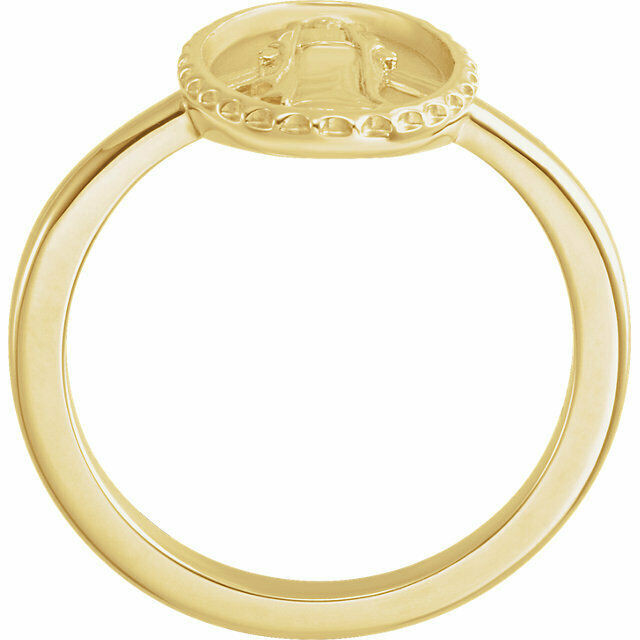 This 14k yellow gold symbolic ring features an oval miraculous medal. 