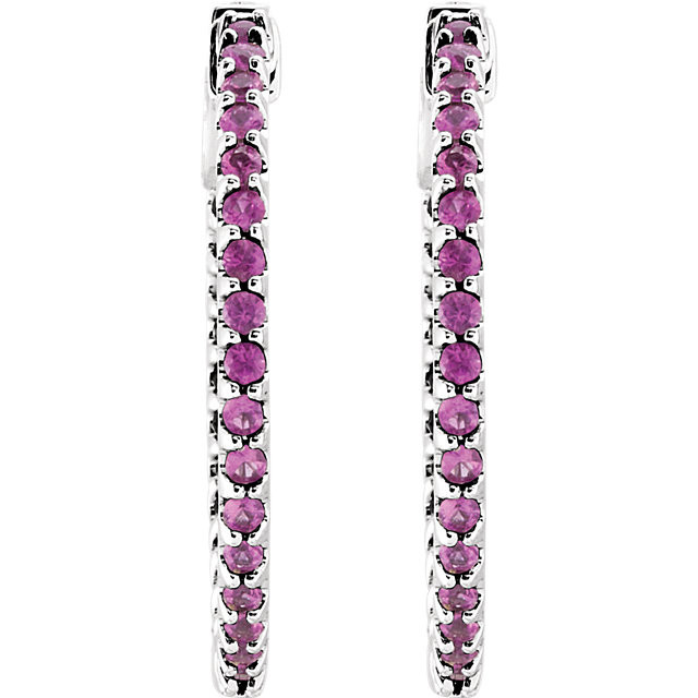 Designed with the October-born birthday girl in mind, these glam and glistening hoops are perfect for her vivacious personality. Fashioned in 14K White Gold, these hoops feature an array of shimmering bright pink sapphires set along the inside and outside edges. Brilliant from every angle, these polished hoops secure comfortably with hinged backs.