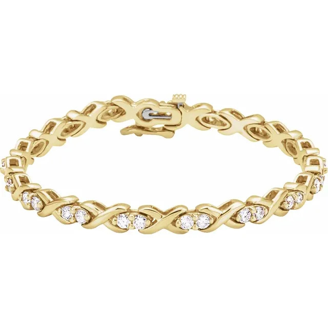 A stylish and traditional design, this classic line bracelet is a great addition to any outfit. Fashioned in warm 14K yellow gold, alternating diamond duos and wave-shaped links create an eye-catching style that's perfect any time. This line bracelet displays 2 1/2 ct. t.w. of diamonds and is finished with a bright polish.  