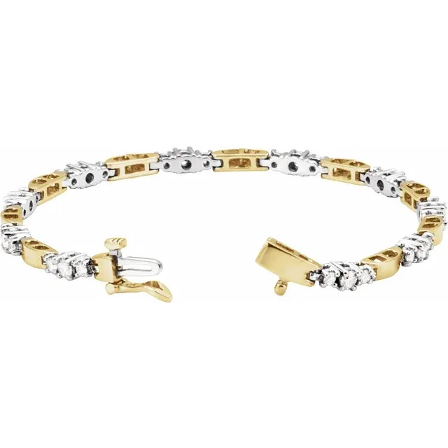 30 round, brilliant cut diamonds are set in 14k white/yellow gold, four-prong tennis bracelet.