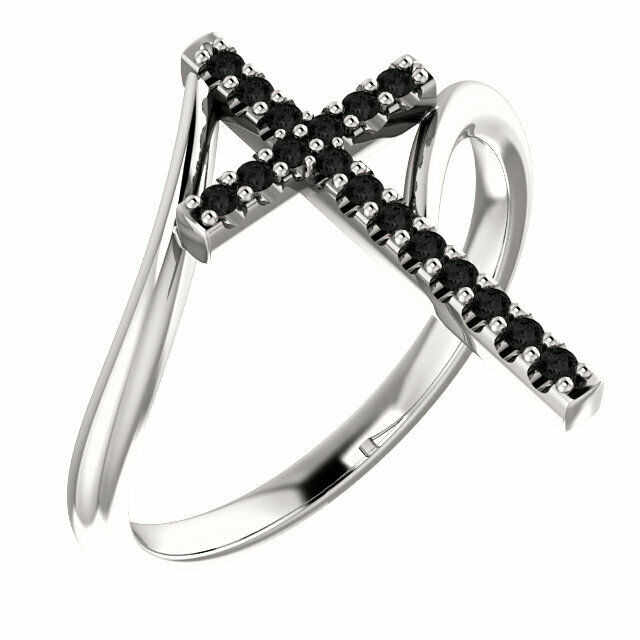 Express your faith with this sterling silver cross ring that is accented with seventeen black diamonds for a bold look. Certain to become a treasured favorite, this ring captivates with 1/8 ct. t.w. of diamonds and a polished shine.
