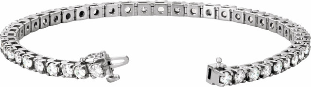 Beautifully crafted, this lab-grown diamond tennis bracelet features forty-six round, brilliant diamonds that are set in a four-prong straight line design. 