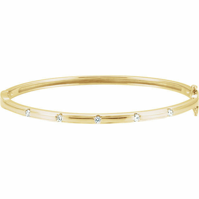 Delicately set in 14k yellow gold, this bangle has five stationed diamonds for a little touch of elegance. 