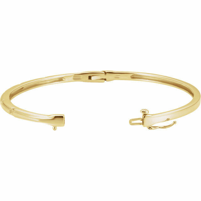 Delicately set in 14k yellow gold, this bangle has five stationed diamonds for a little touch of elegance. 