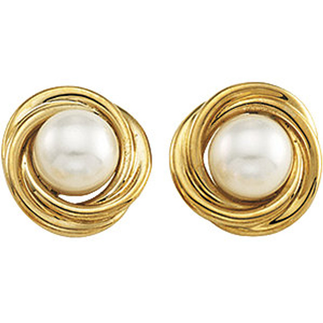 These lovely earrings feature 6mm white cultured pearl gemstone set in 14k yellow gold. Polished to a brilliant shine.