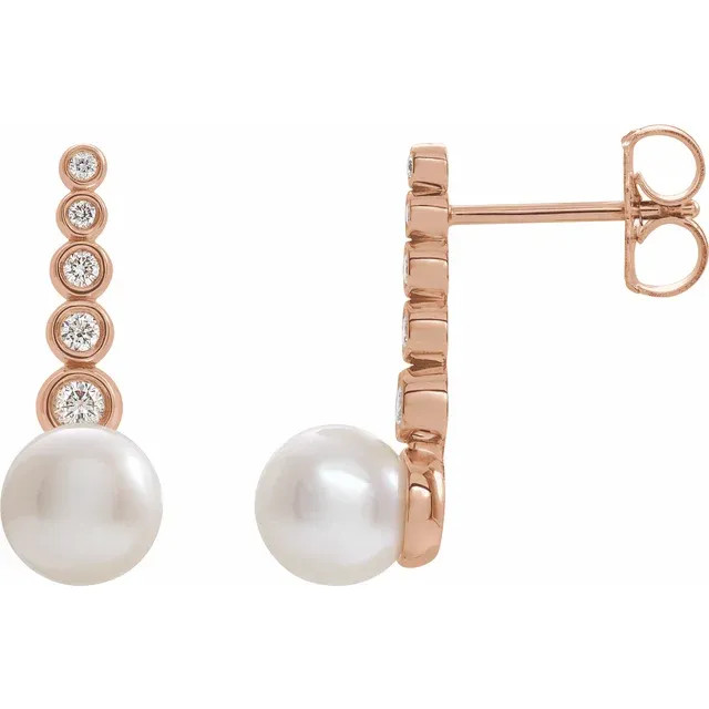 These beautiful pearl earrings feature two lustrous AA+ quality 5.5-6.0mm white freshwater pearls. The pearls are mounted on 14k rose gold with dazzling I1 clarity diamonds. 