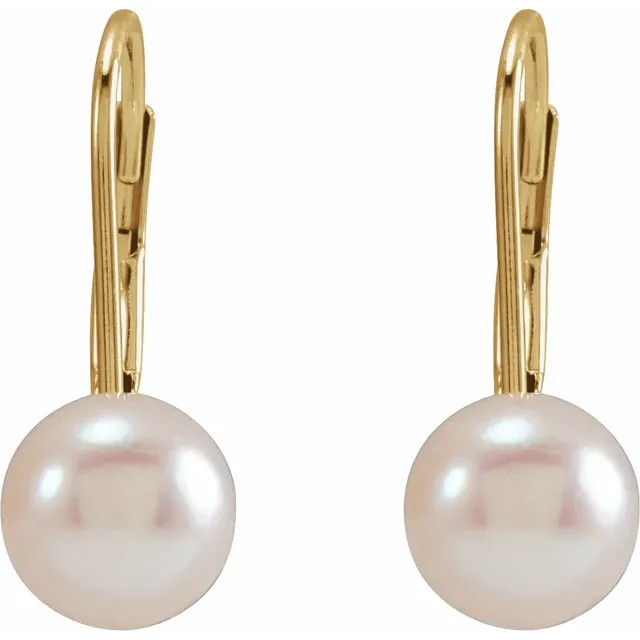 With ease and elegance, these pearl drop earrings complete her tailored anytime attire.
