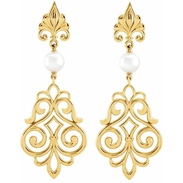 With ease and elegance, these pearl drop earrings complete her tailored anytime attire.