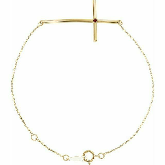 This bracelet fashioned in 14k yellow gold features a sideways cross centered along a 8.0-inch chain that secures with a spring ring clasp.