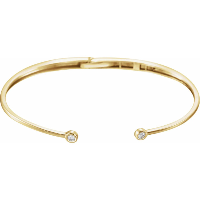 This 14K yellow gold hinged cuff bracelet is a stunning addition to any jewelry collection. With a length of 7 inches, it is the perfect size to accentuate the beauty of any wrist. The bracelet features 1/6 CTW natural diamonds that add a touch of sparkle to any outfit.
