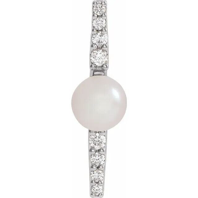 Make a bold and modern fashion statement with this cultured freshwater pearl & Diamond Pendant in 14k white gold showcased by 8 sparkling accent diamonds set off by a singular freshwater cultured freshwater pearl.

Cultured freshwater pearls measure approximately 6mm to 6.5mm in diameter. Diamonds are rated I1 for clarity, G-H for color, with 1/6 total carat weight. 