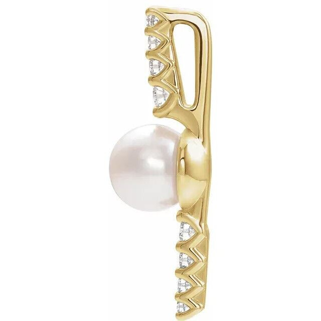 Make a bold and modern fashion statement with this cultured freshwater pearl & Diamond Pendant in 14k yellow gold showcased by 8 sparkling accent diamonds set off by a singular freshwater cultured freshwater pearl.

Cultured freshwater pearls measure approximately 6mm to 6.5mm in diameter. Diamonds are rated I1 for clarity, G-H for color, with 1/6 total carat weight. 