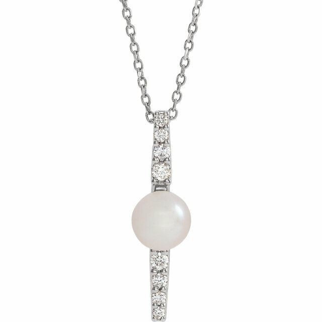 Make a bold and modern fashion statement with this cultured freshwater pearl & Diamond Pendant Necklace in platinum showcased by 8 sparkling accent diamonds set off by a singular freshwater cultured freshwater pearl.

Cultured freshwater pearls measure approximately 6mm to 6.5mm in diameter. Diamonds are rated SI2-SI3 for clarity, G-H for color, with 1/6 total carat weight.

This distinctive pendant comes suspended on a platinum chain in your choice of lengths (16" or 18"), secured with a ring clasp. 