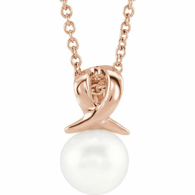 This Freshwater cultured pearl, attached to an 14k rose gold bail, suspends from a delicate 14k rose gold cable chain. Perfect for wearing alone or layering it with other pieces, it is suspended from a matching cable chain that can fasten at 16 or 18 inches. 