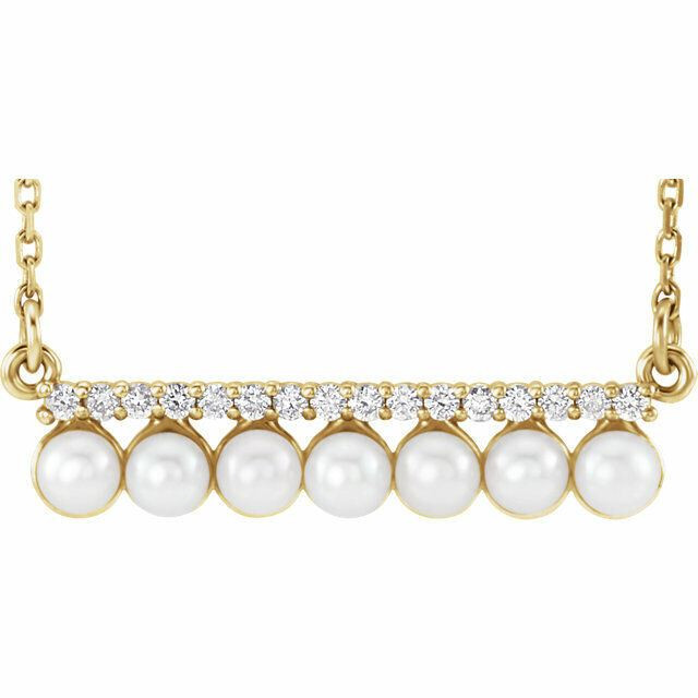You shouldn't have to choose between diamonds and pearls. Here, a gleaming row of four 3mm cultured freshwater pearls is bordered by a slim bar of .06 ct. t.w. diamonds set in polished 14kt yellow gold.