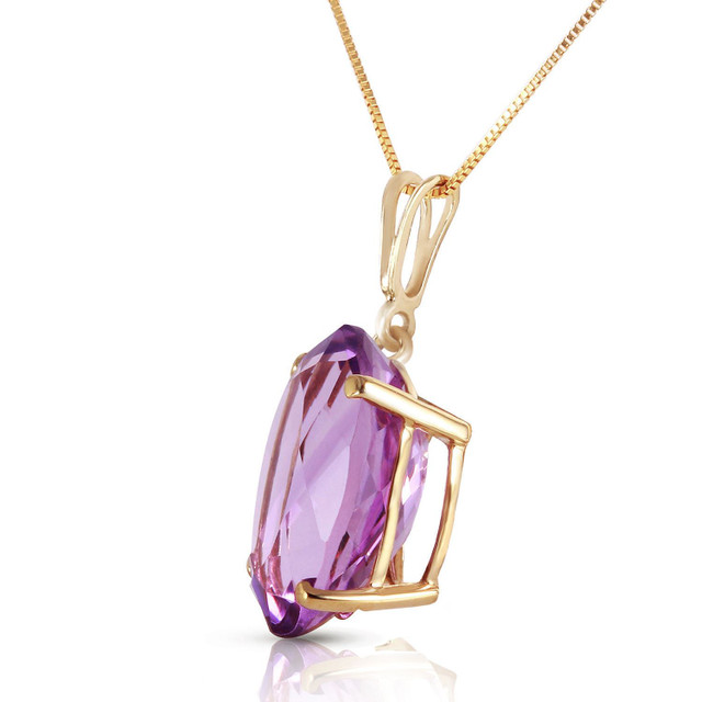 A traditional solitaire pendant featuring a birthstone is a beautiful gift, either for yourself or someone else. Celebrate a February birthday with this fabulous 14k solid gold necklace with oval purple amethyst. This sleek and beautiful necklace keeps things simple by showing off the stunning purple glow of amethyst.

The oval shaped stone measures in at a whopping 7.55 carats, showcasing the true beauty of this amazing stone. The 18 inch box chain is delicate enough to leave the spotlight on this sparkling stone, while also adding the rich luxury of solid 14k gold, available in yellow, white, or rose gold.