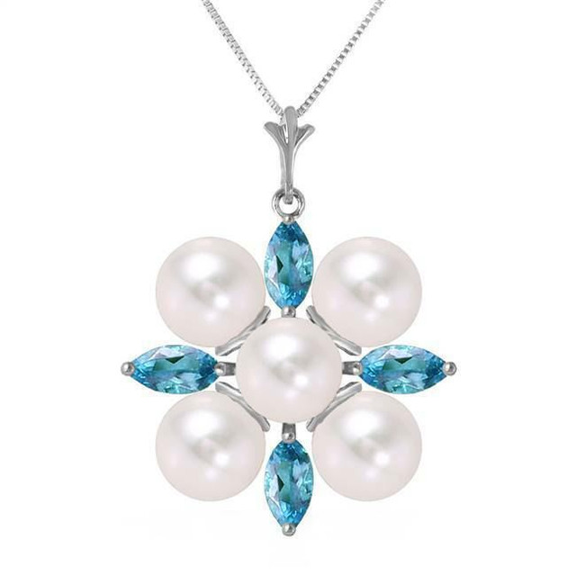  You will look cool and crisp as a winter morning when you wear this 14K. white gold necklace with blue topazes and pearls. A grouping of five glimmering pearls is surrounded by four marquise cut topazes that glitter when the well-crafted facets catch the light. The round pearls measure at 5.00 carat weight and the topazes are 1.30 carats in weight.
 
The pendant measures a little over an inch in height. If you are not buying a necklace for yourself today, consider this beautiful piece for a friend or family member born in June or December.