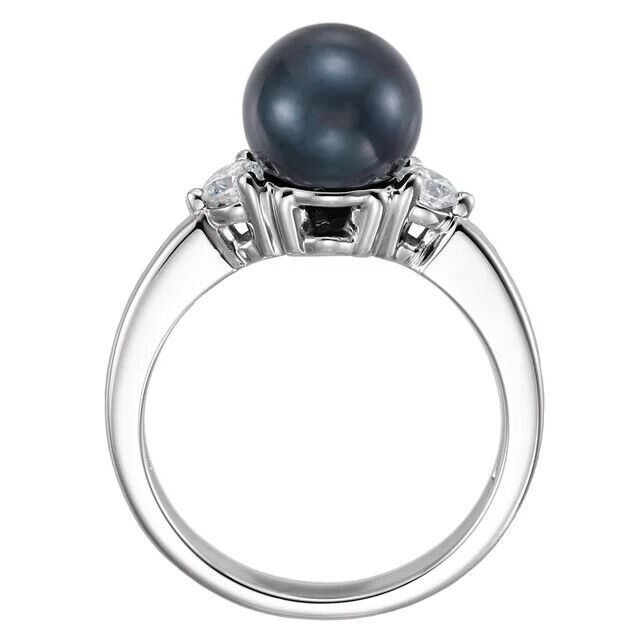 Simple yet spectacular, this tahitian cultured pearl & diamond ring makes an elegant statement. Diamonds are G-H in color and I1 or better in clarity. Polished to a brilliant shine.