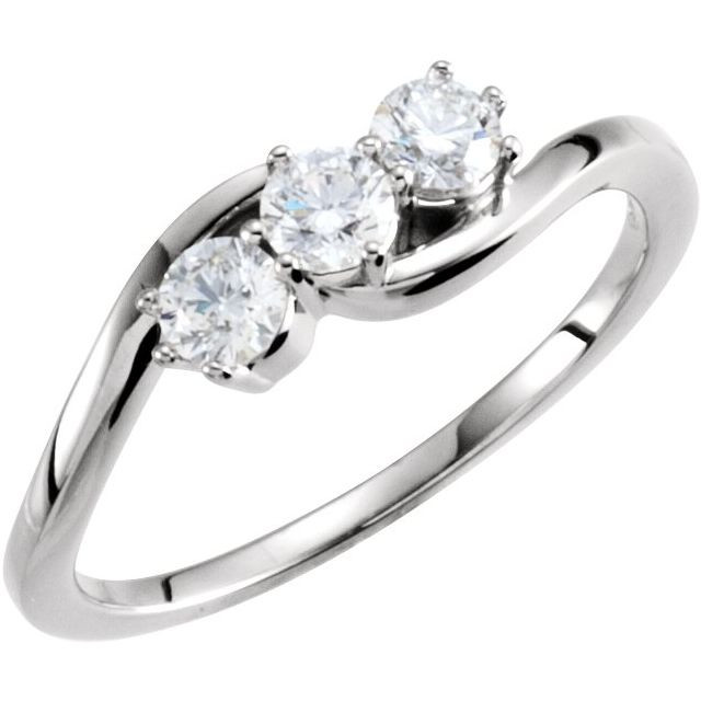 A three-stone ring, also known as a trilogy or trinity ring, symbolizes the past, present, and future of a relationship. The center stone represents the present, while the side stones represent cherished memories from the past and the promise of a future together.